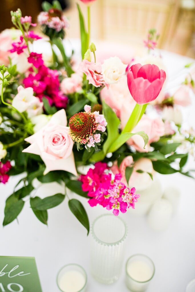 closeup of the floral centerpieces at a riverside hotel wedding