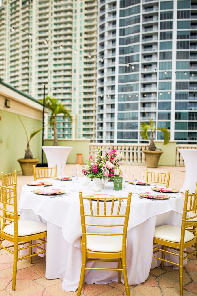 Guest dining table on the skyline terrace for a riverside hotel wedding