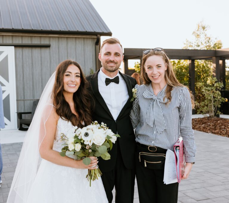 Certified Wedding Planner Megan Fioto with bride and groom at wedding